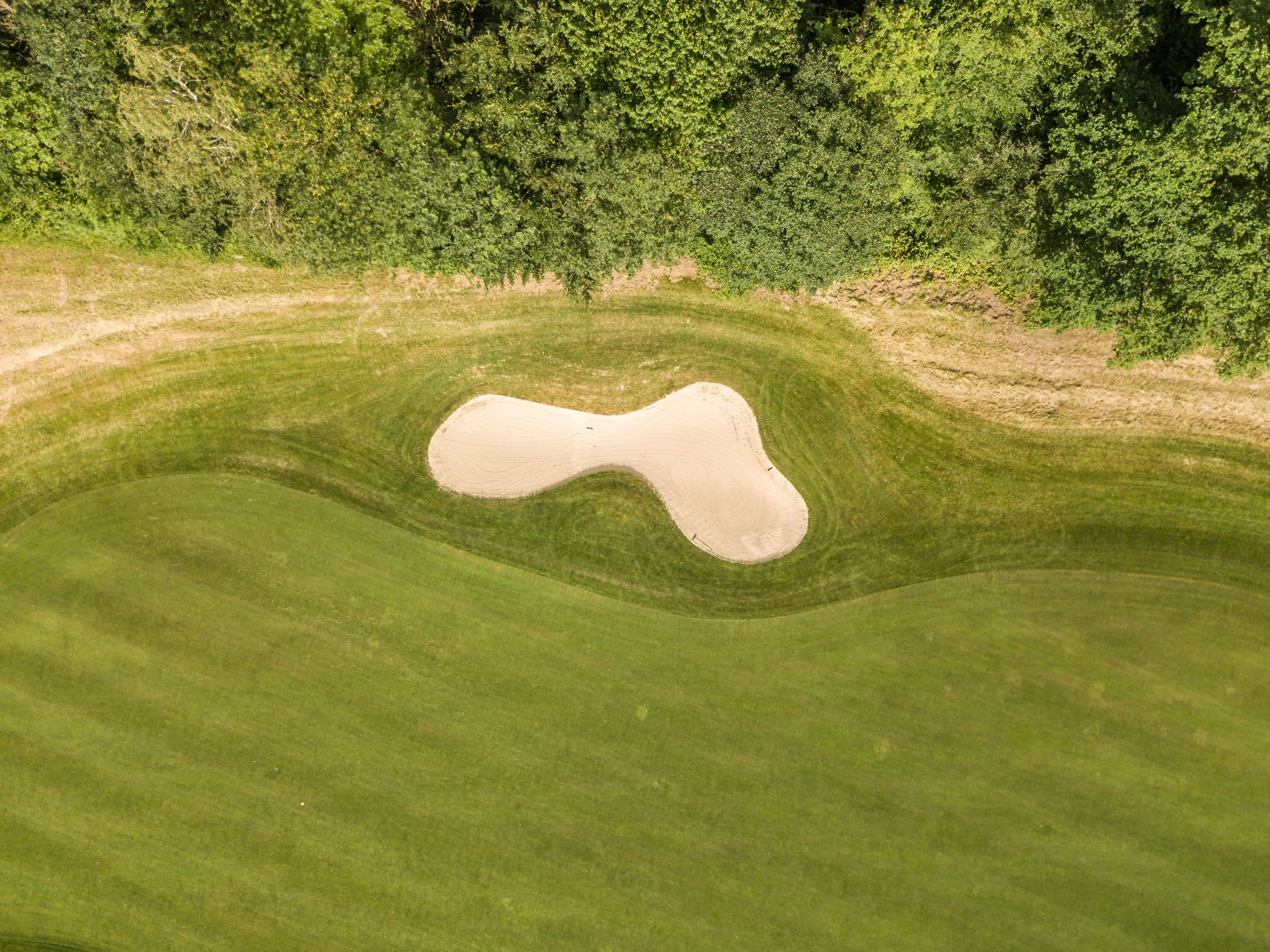 View from above of a sand trap on a golf course